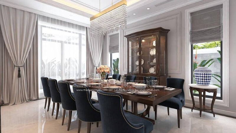 Bố trí nội thất phòng ăn gỗ óc chó tân cổ điển đẹp, sang trọng từ bàn gỗ nguyên khối, ghế bọc nệm cao cấp, kệ, tủ kệ trang trí. Mẫu nội thất biệt thự đẹp